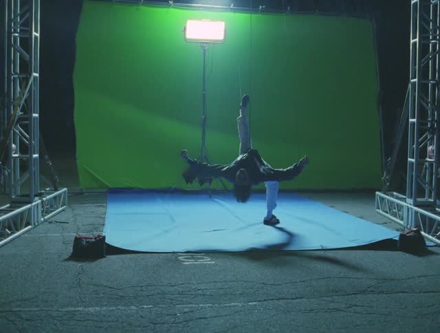 Man in the spotlight hanging in the movie set