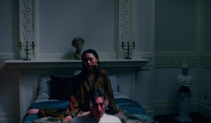 A man sits down on the floor