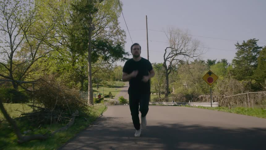 A man jogs down the road