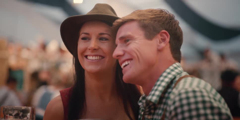 A man and woman smile together