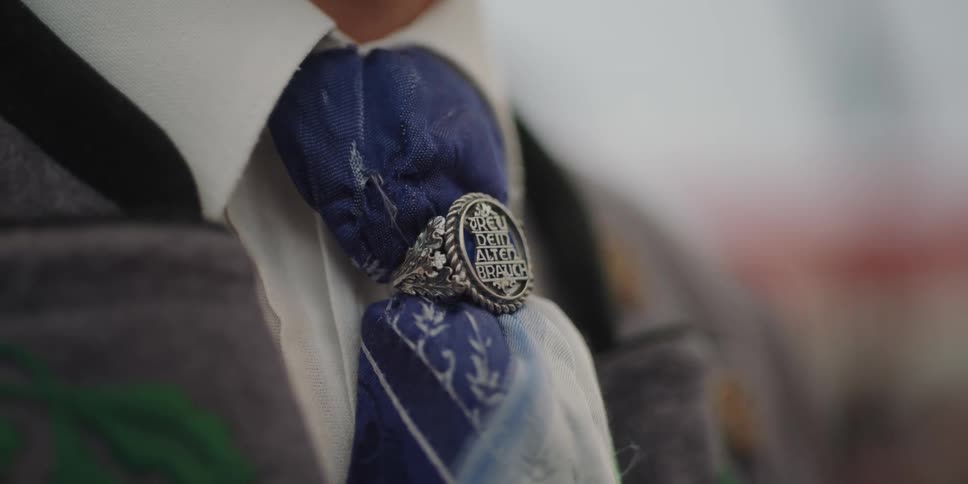 A person is wearing a blue tie