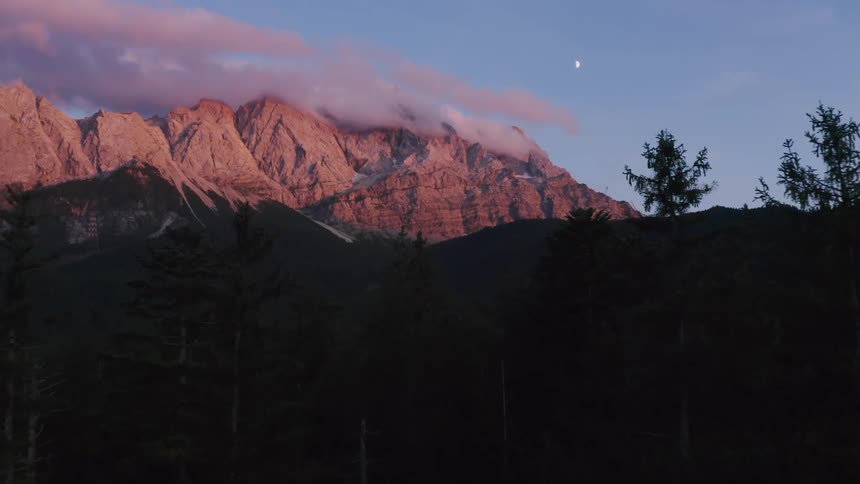 Snow covered mountains landscape at dusk