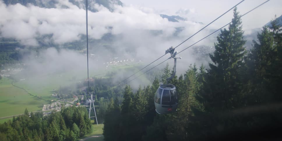 Gondolas moving down a hill