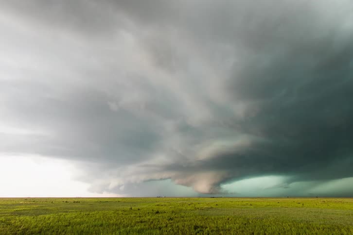 A tornado grows in the sky