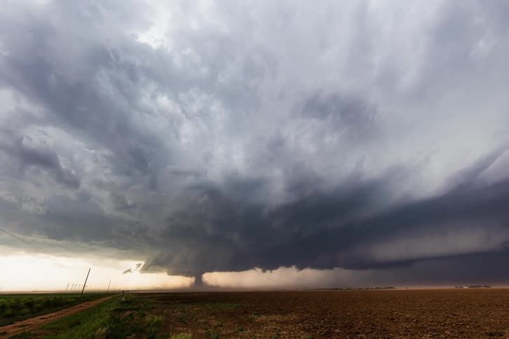 A tornado touches down in a corn field
