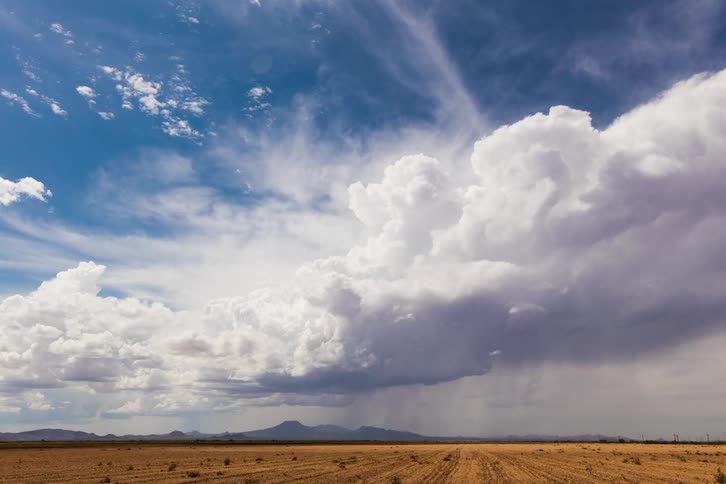 White clouds gather and float in the blue sky