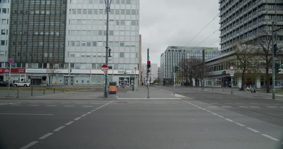 A gray looking city block on a cloudy day