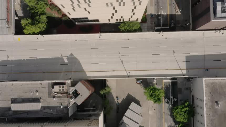A wide bridge running through several blocks of a city