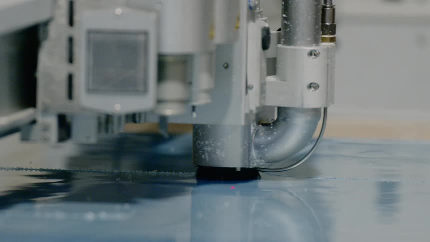 An automated plotter cuts material