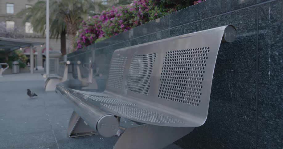 A bench is outside in a neighborhood