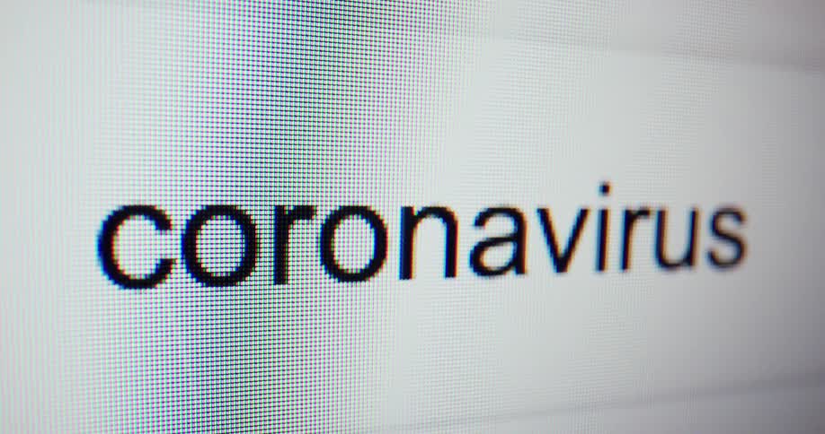 A close up of a monitor with coronavirus typed on it