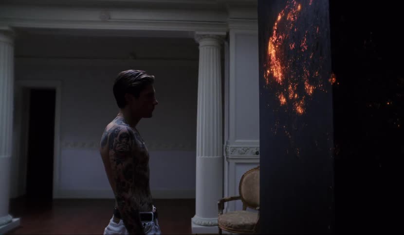 Man stands contemplating black box glowing from within