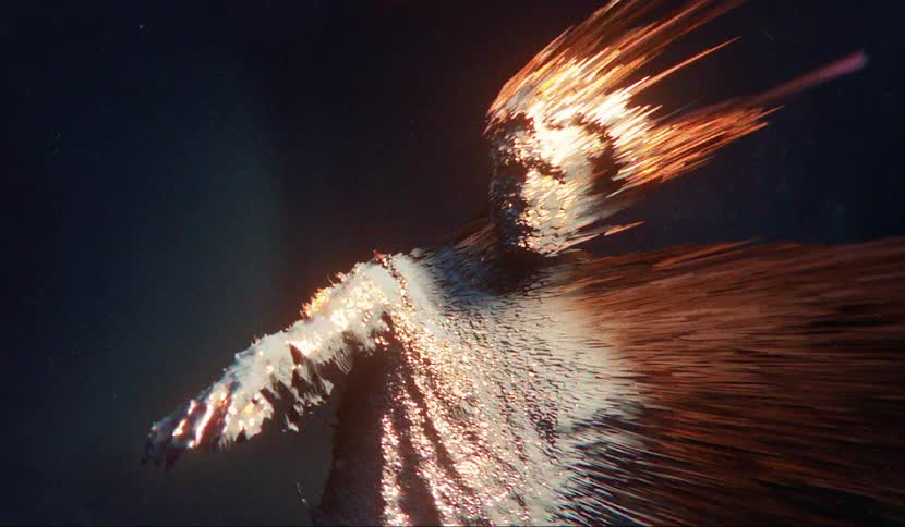 A male that appears dressed up as a statue had flames flying off of his body