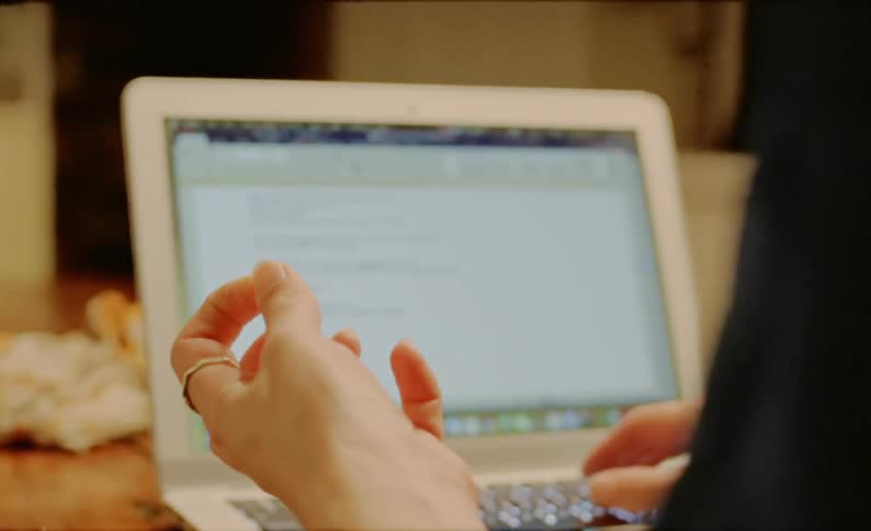 A person typing on a computer