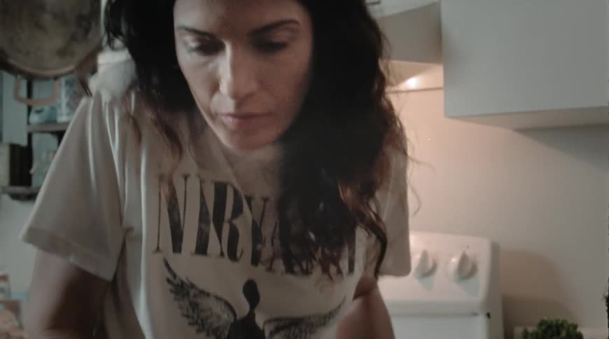 A woman cooking a meal at home