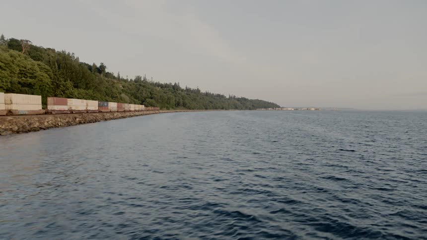 A container train traveling along the coast