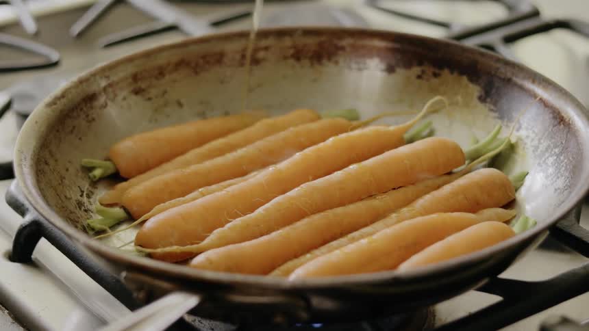 Carrots cooking in a pan