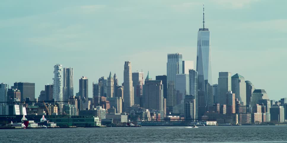 Skyline of a city with a boat on the water