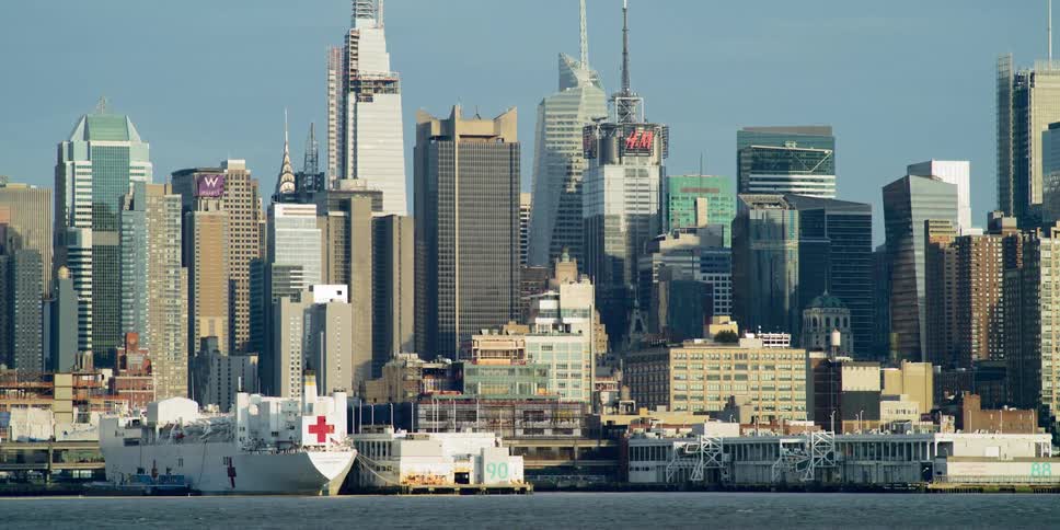 Skyline of a city with boats on the water