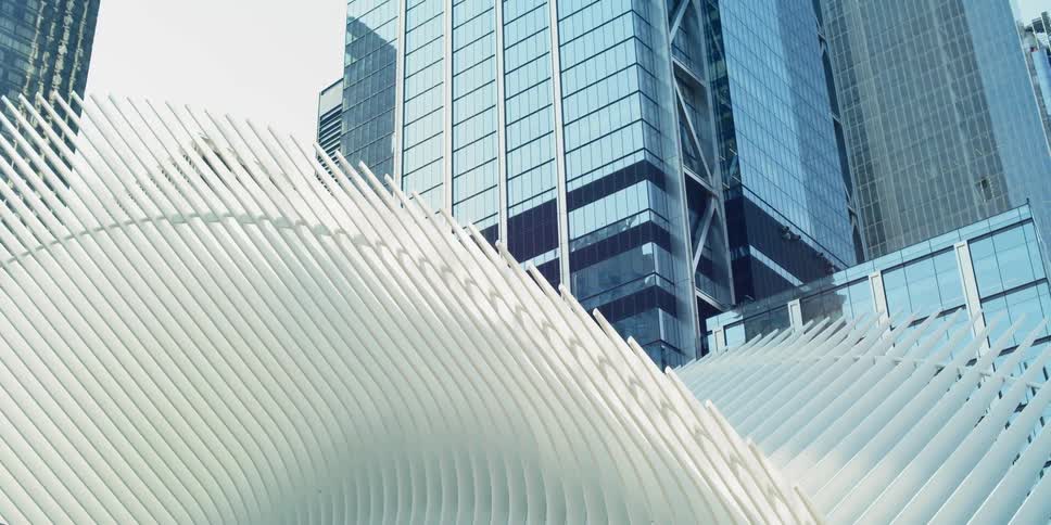 Ribs flare out on structure at base of skyscraper