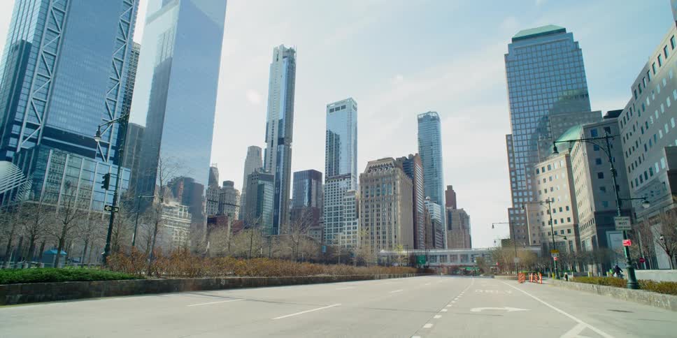Street stands empty near downtown tower block during the day