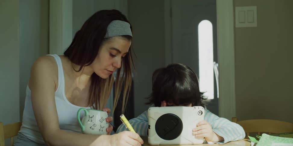 Mother and son sitting at a table