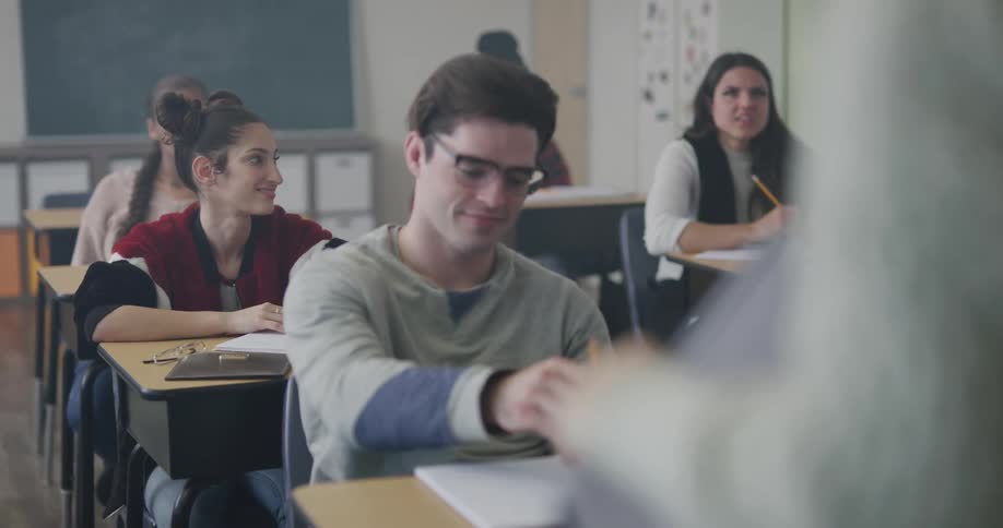Students sit in a classroom
