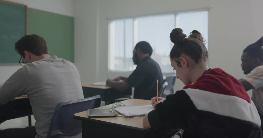 Four students work at their desk