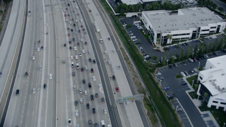 Birds eye view of cars driving down a freeway