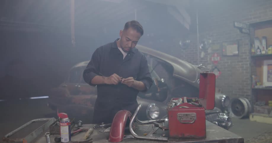 A mechanic gets his tools together