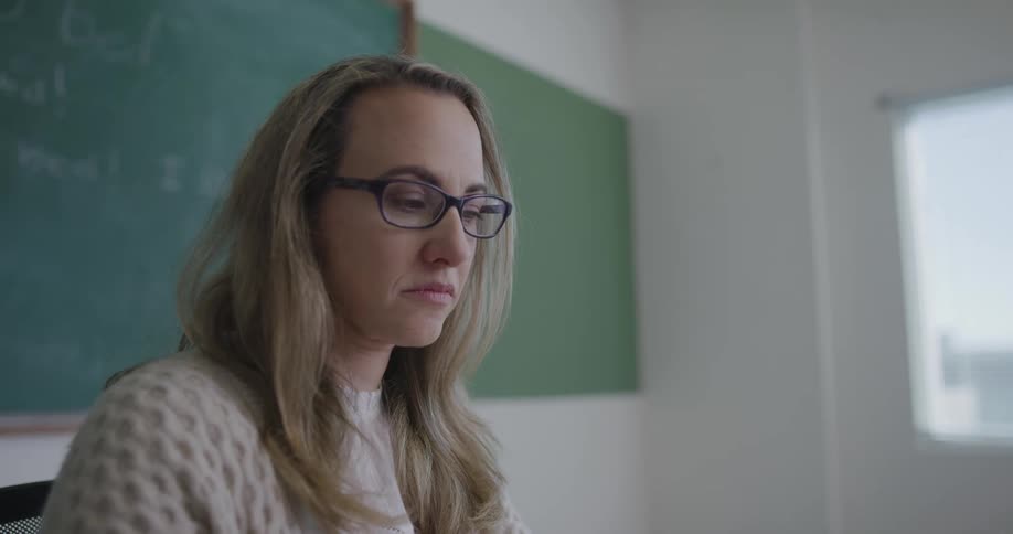 A teacher talks to her class