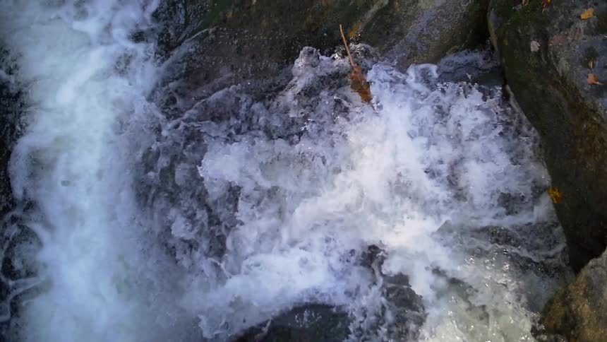 Overhead view of water falling down a waterfall
