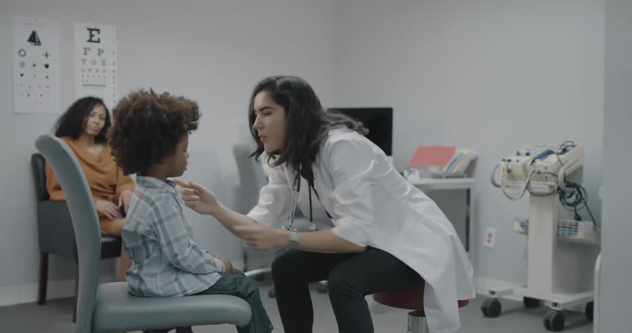 A doctor doing a check up on a child