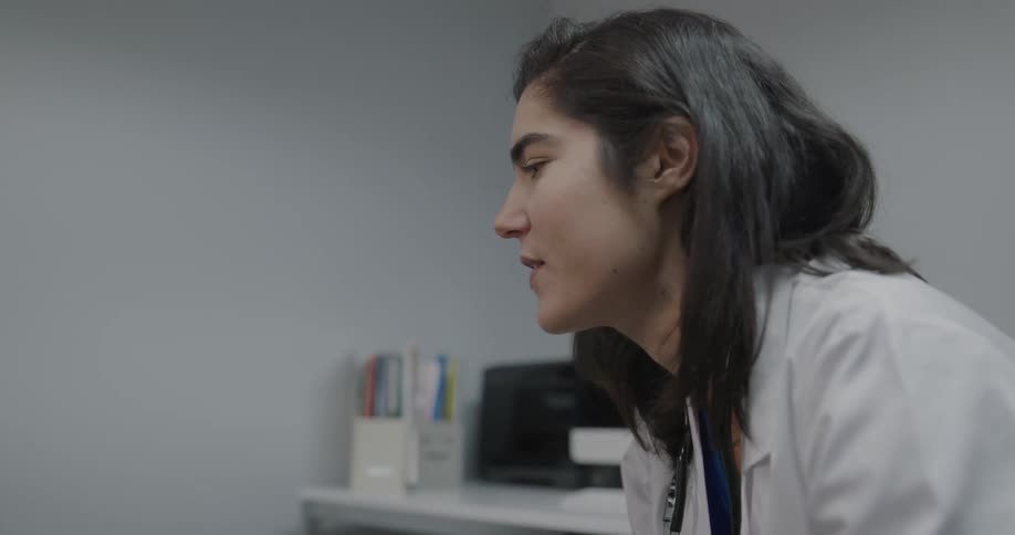 A doctor talking to a mother and son