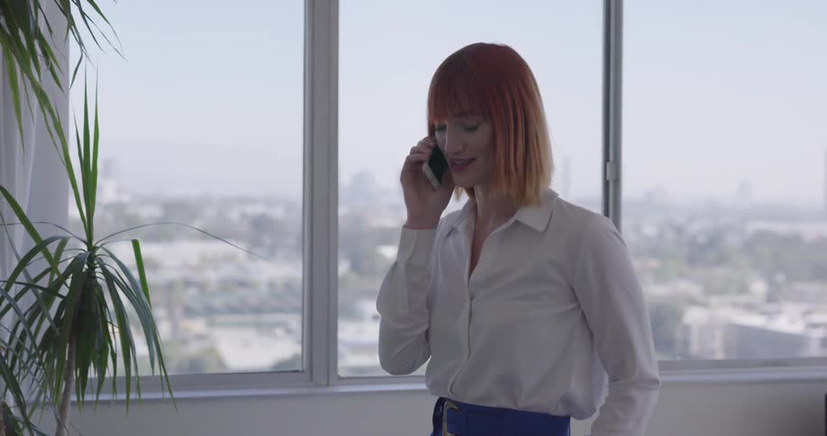 A woman talking on a phone