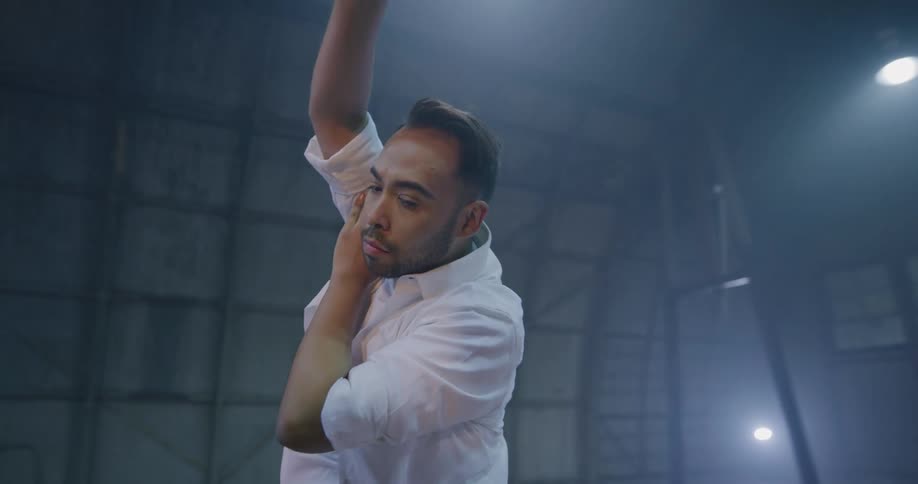 A man with a white shirt dancing
