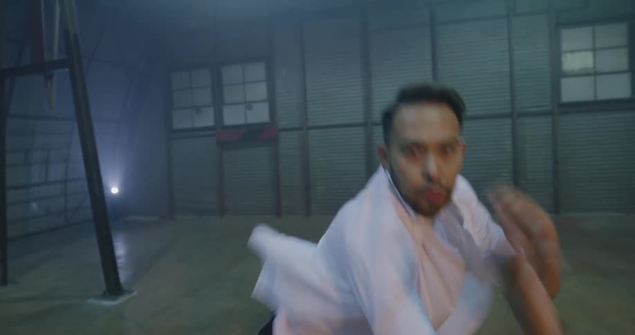 A man dancing in an empty room