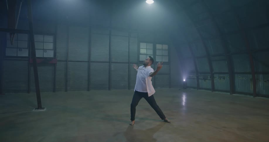 A man dances in the building