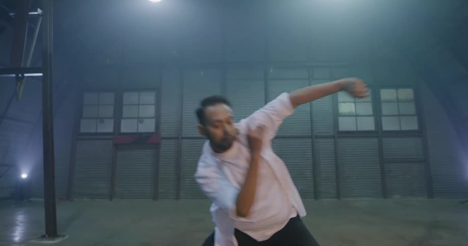 Dancer performs free form dance moves on stage