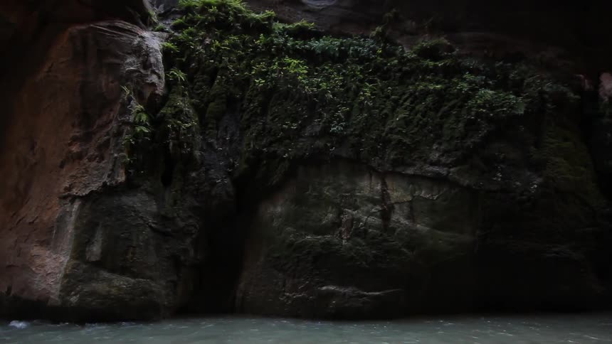 Water flowing below a cliff face