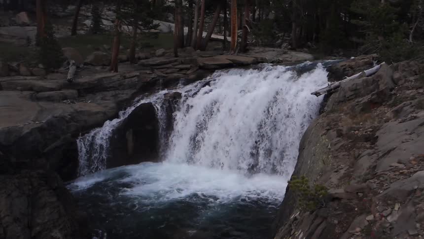 A river runs over a small cliff