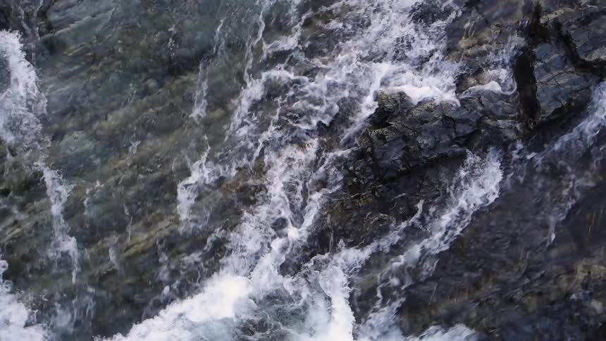 Water cascading down a cliff face