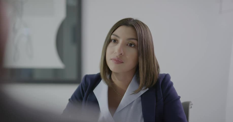 Women sitting down in an office talking