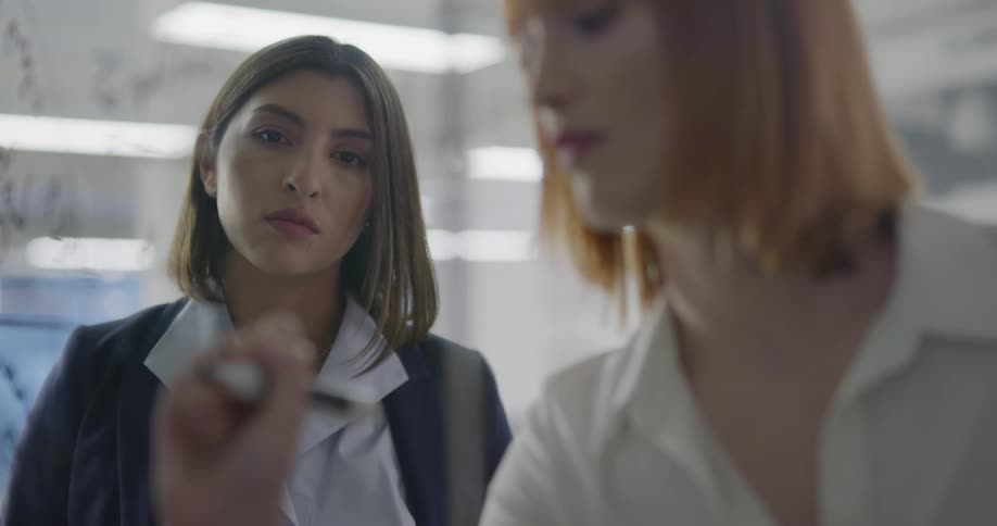 Two females work together