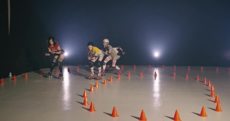Four women skate on the rink