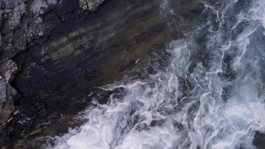 Water spilling into a pool of water