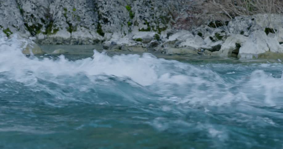 Turbulent waters on rapids in the pyrenees mountain range