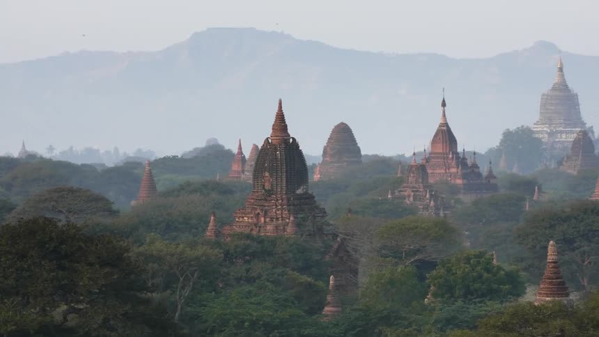 Ancient temples rise from a jungle canopy