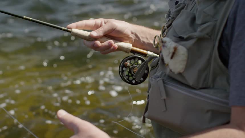 A man pulls on a fishing line