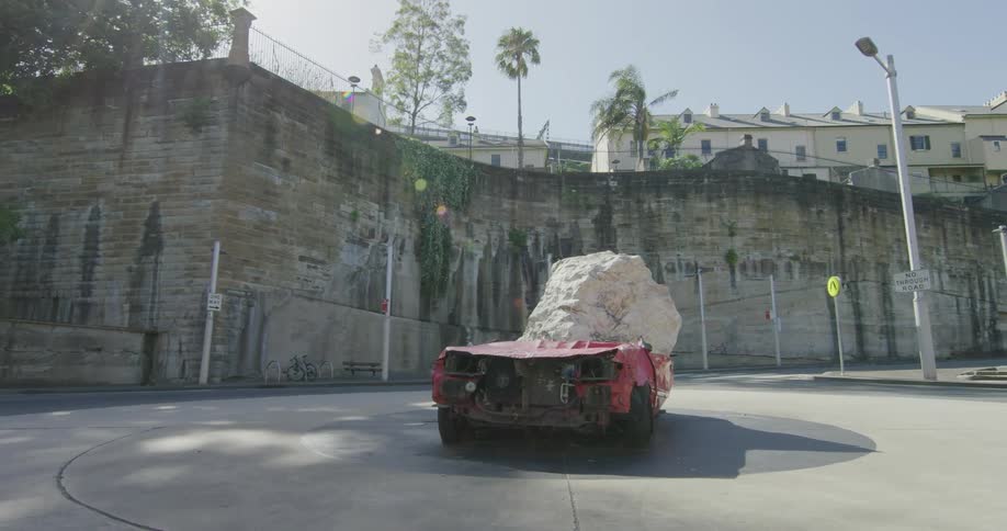 Big rock fallen on the junk car
